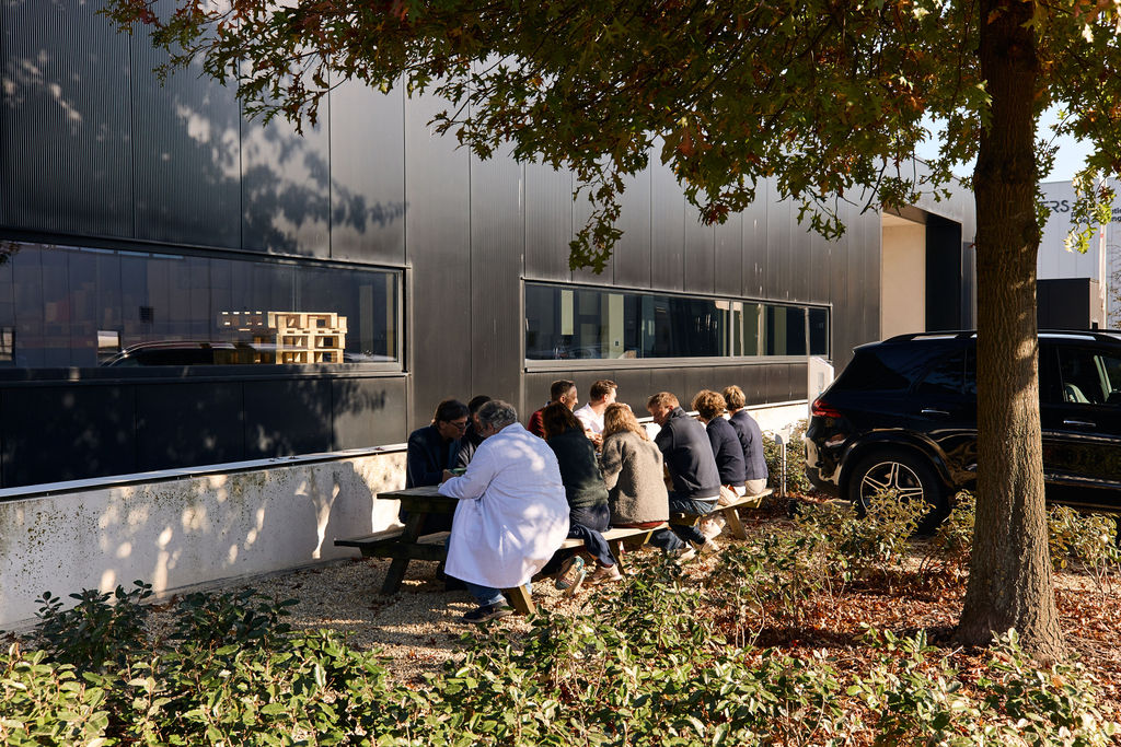 Reynders employees collaborating in outdoor meeting area